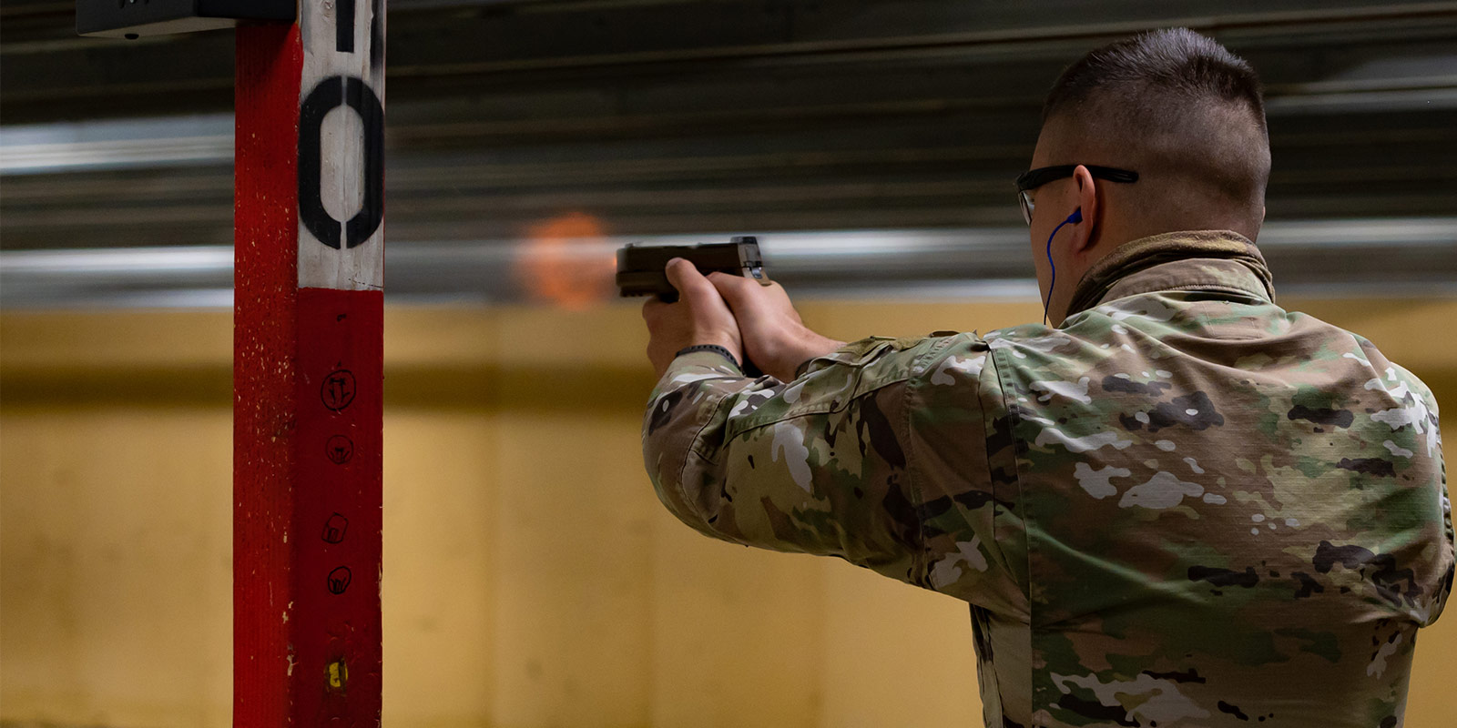 Airman holding a M9 Semiautomatic Pistol