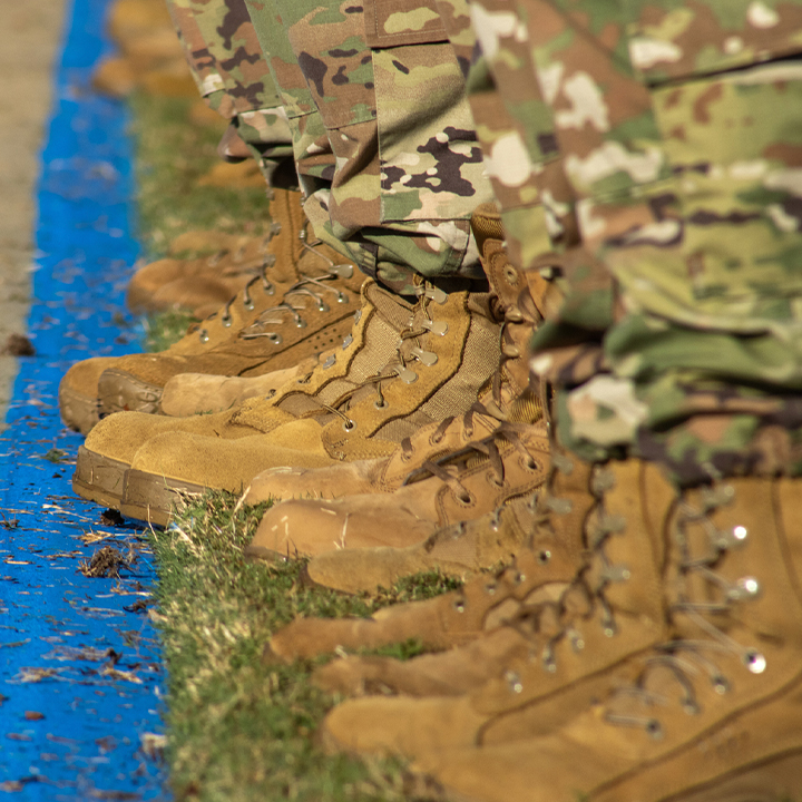 image of combat boots worn by recruits lined up next to each other