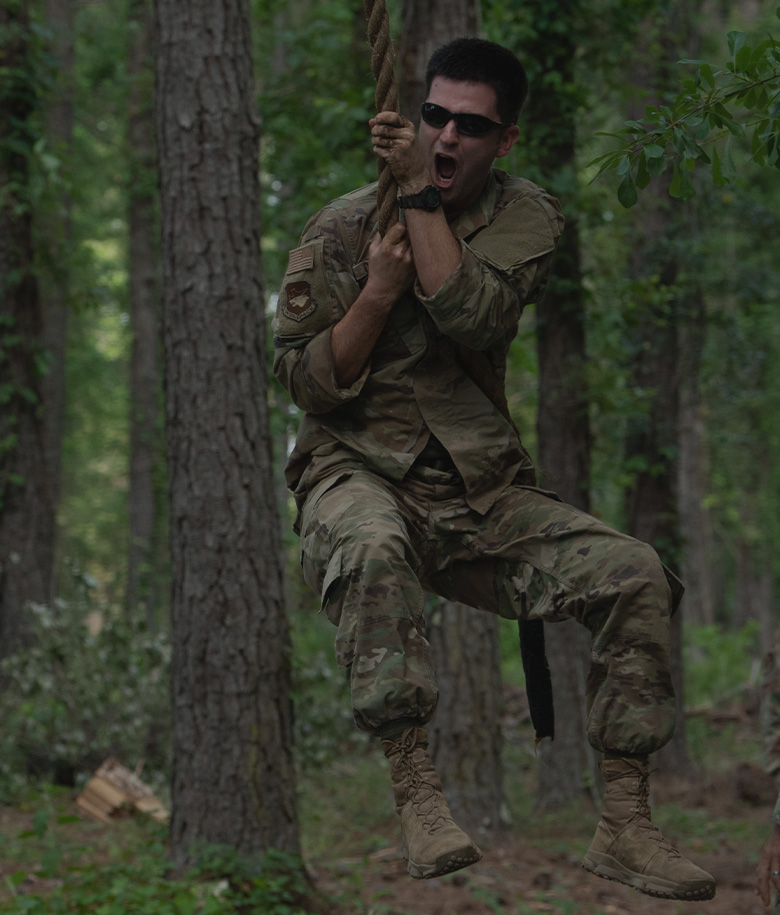 Trainee hanging in a rope swing