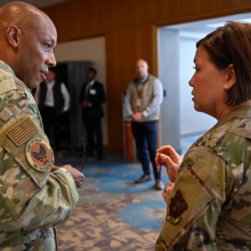 Gen Brown and CMSAF Bass engaging in conversation