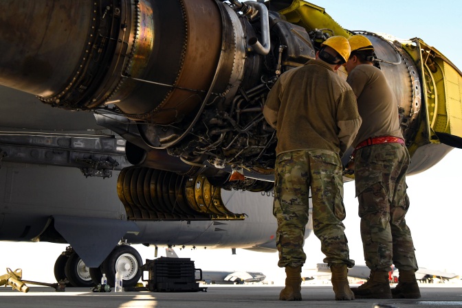 airmen inspecting an aircraft