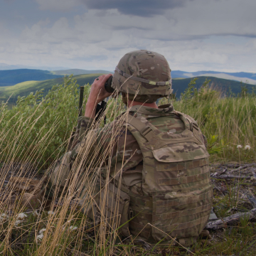 airmen in field on the lookout