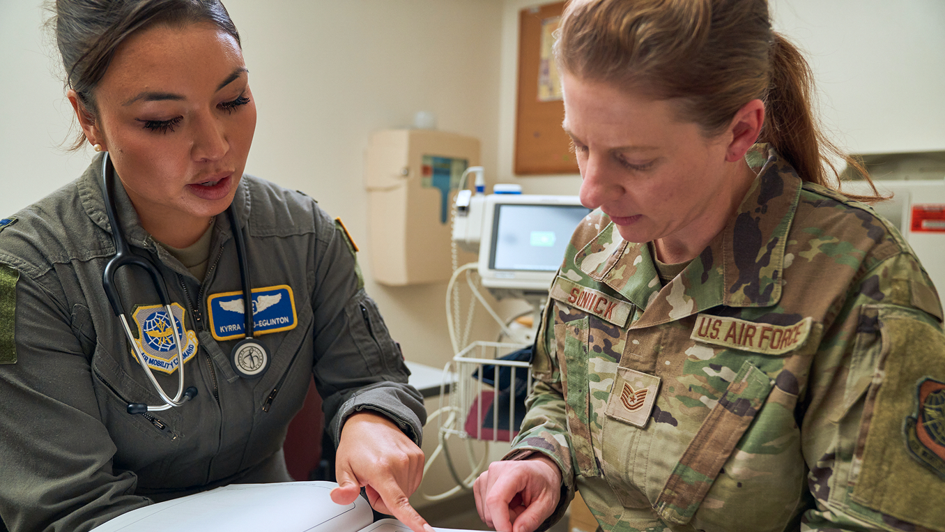 flight surgeon speaking to another airman