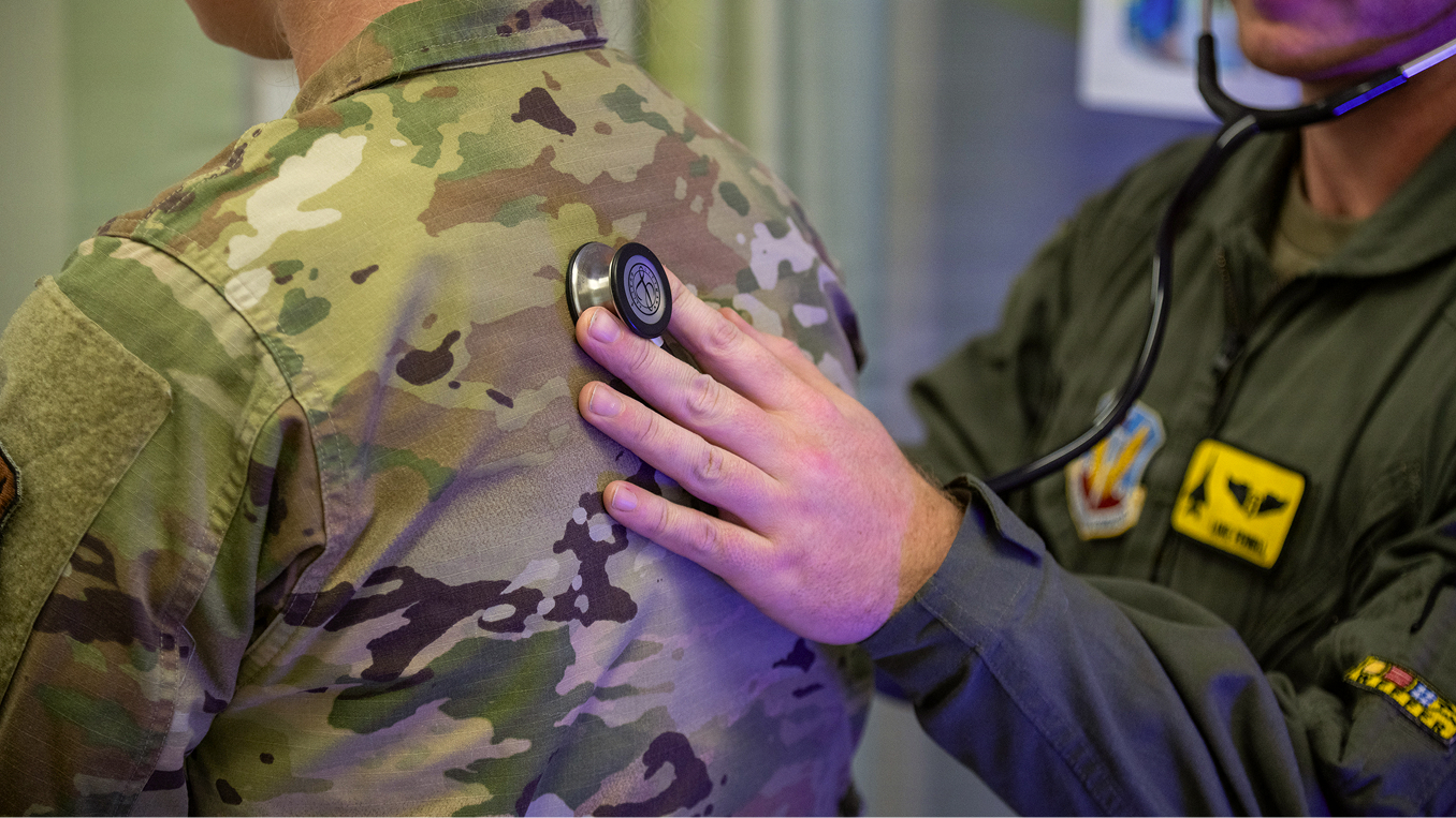 flight surgeon checking heartbeat