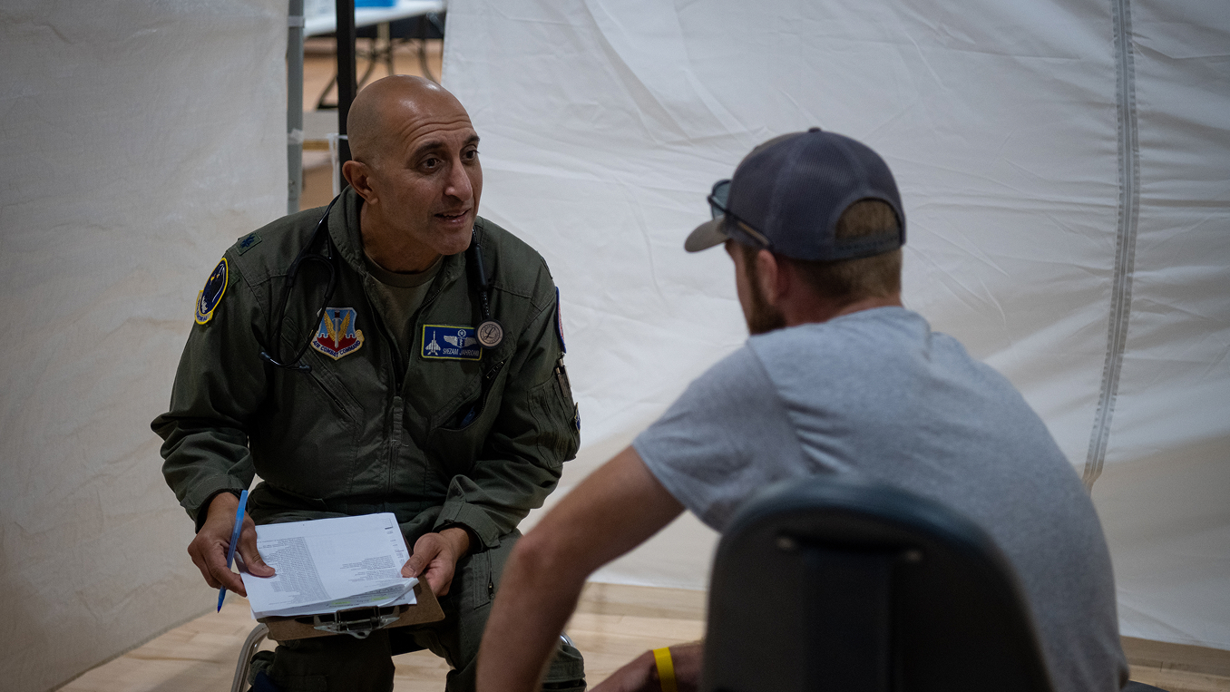 residency trained flight surgeon speaking to patient