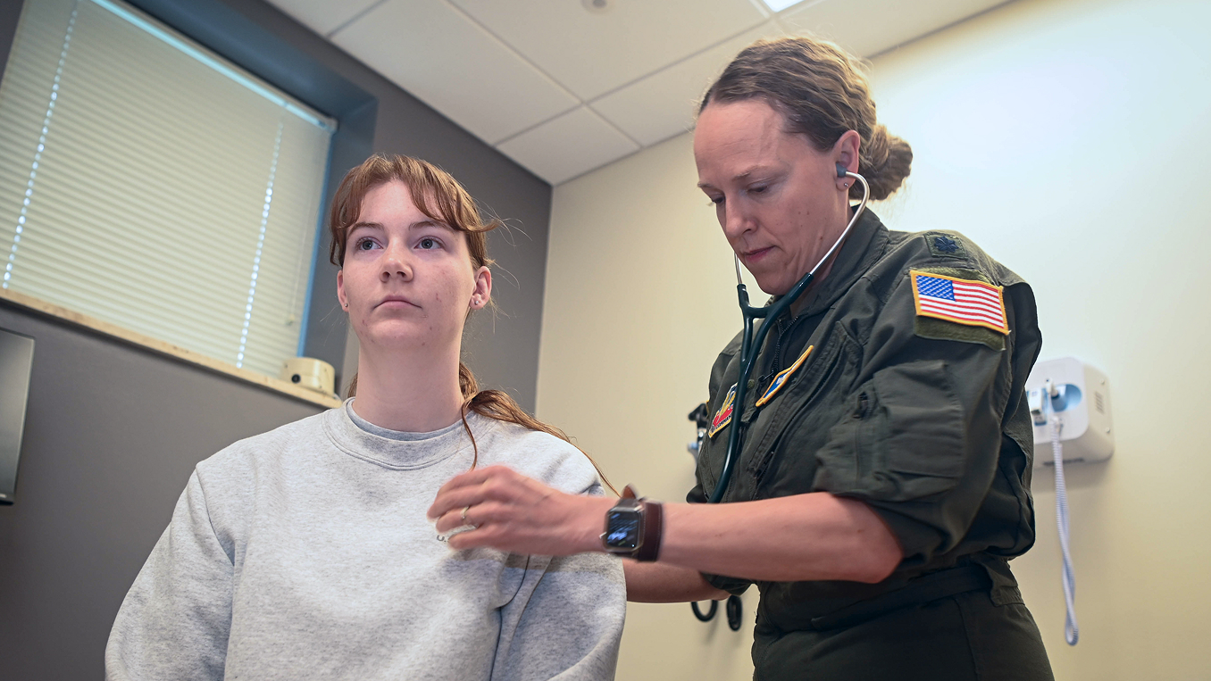 residency trained flight surgeon checking heartbeat