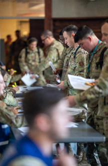 airmen standing in room