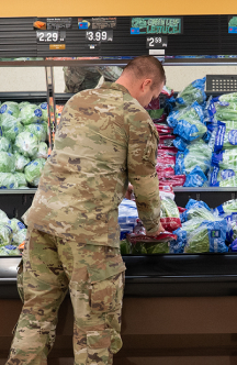 Airman picking produce