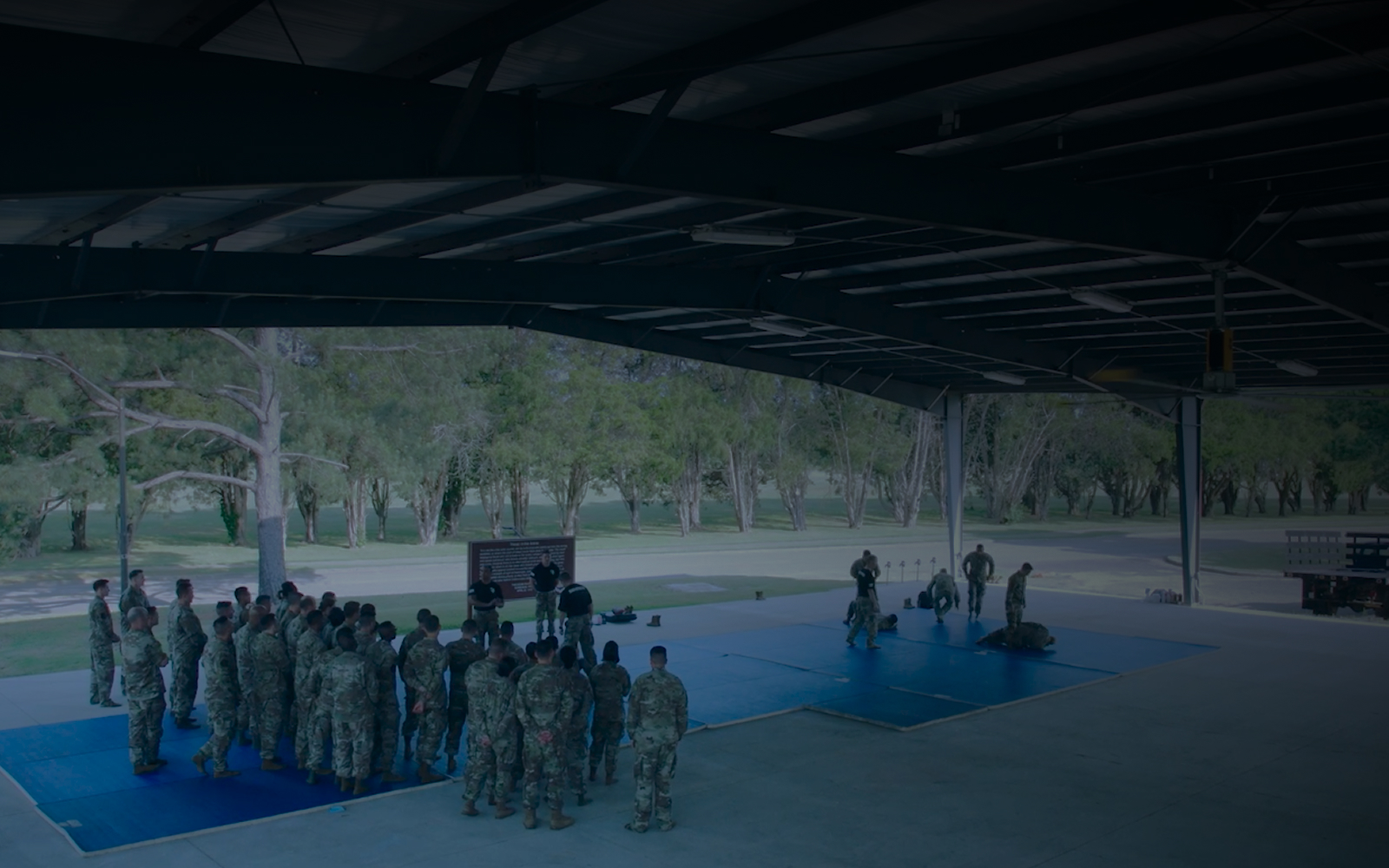 trainees huddled listening to speaker