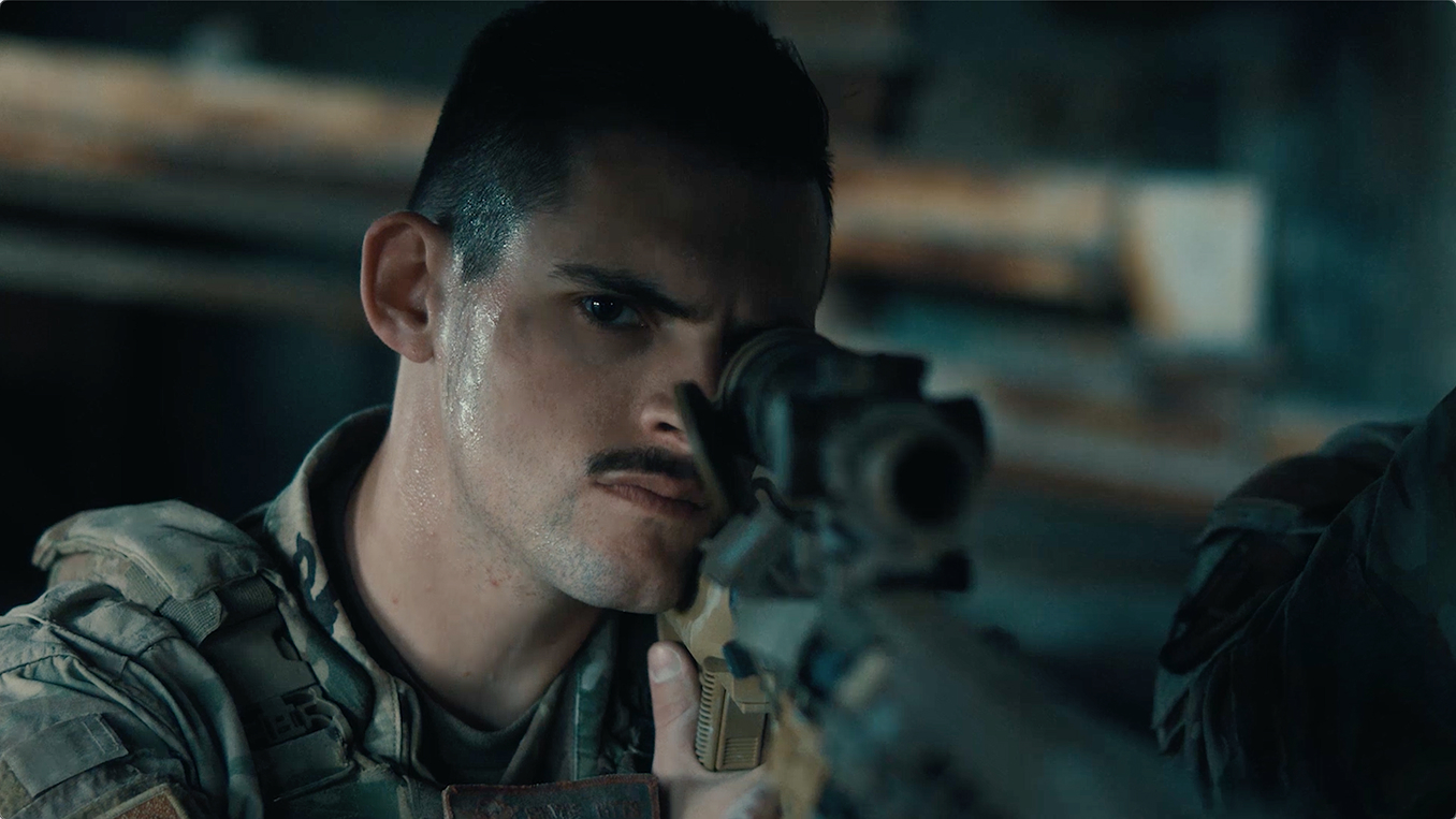 close up of airman holding weapon