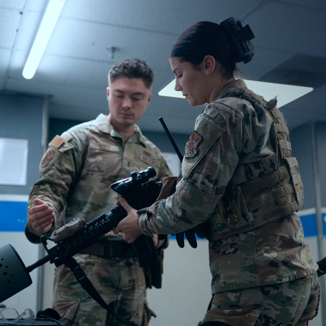 airmen handling rifle