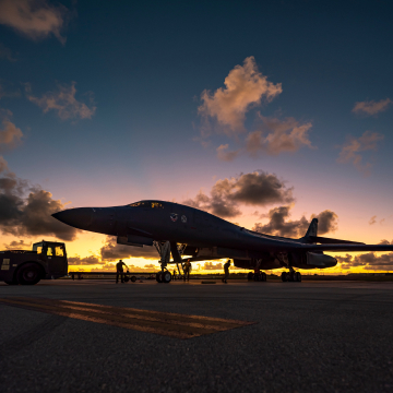 Air National Guard plane in silhouette in Guam at sunset