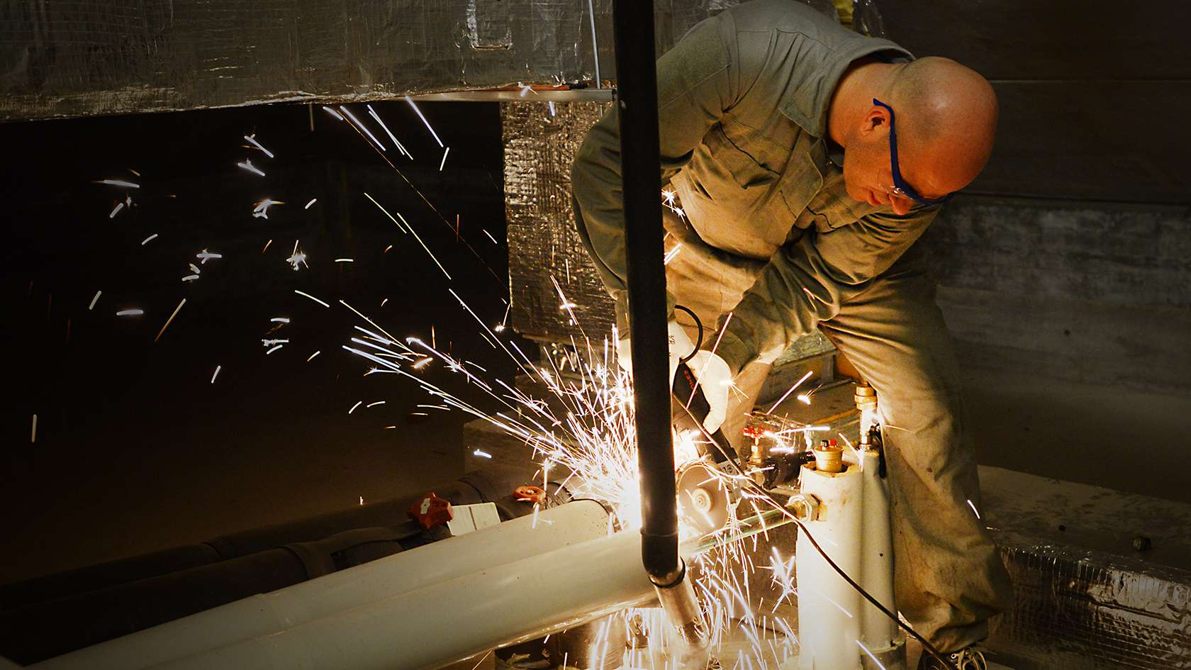 airman repairing HVAC system