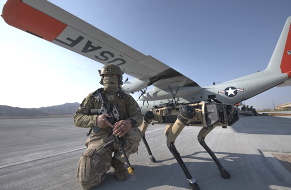 Airman with robotic dog on the flightline