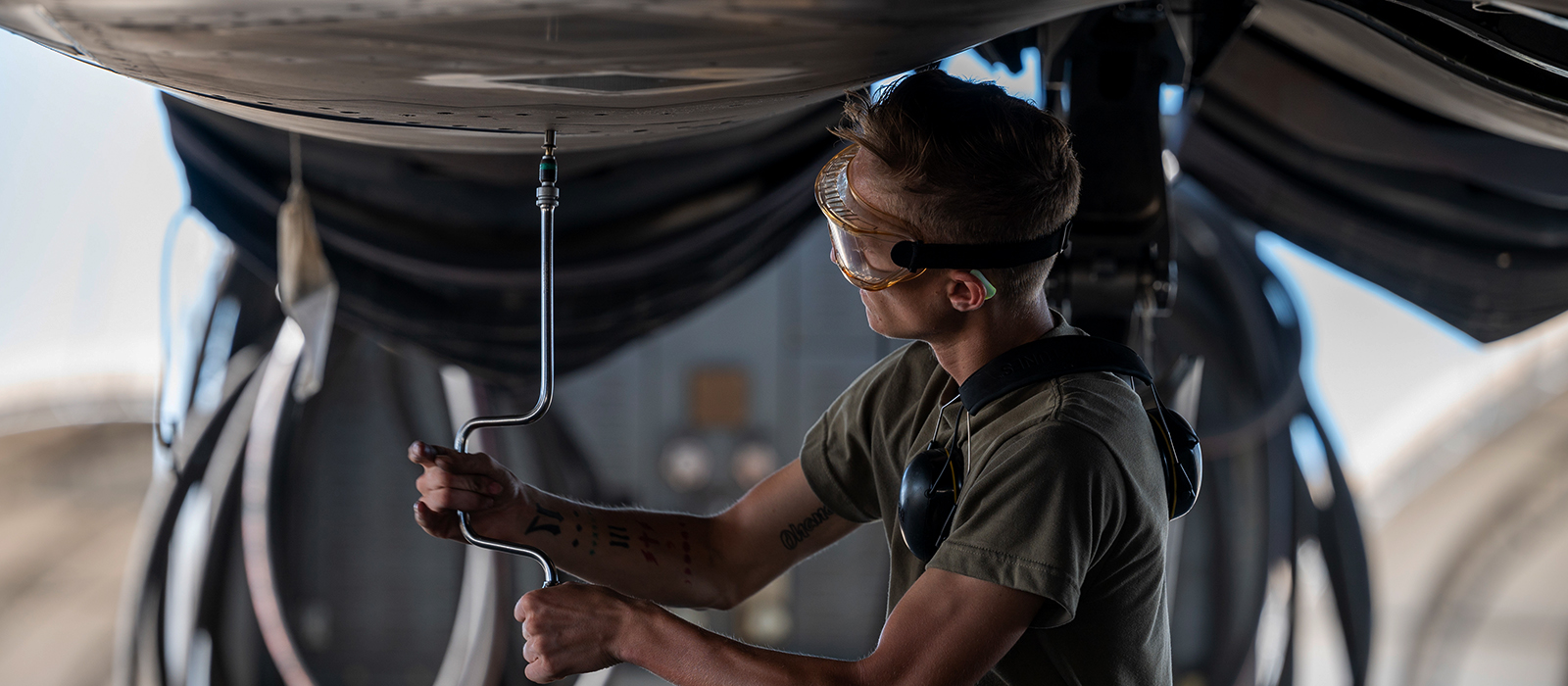 airman working on a plane