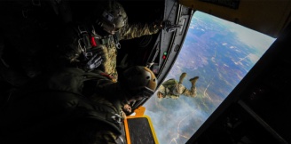Airmen jumping from an aircraft