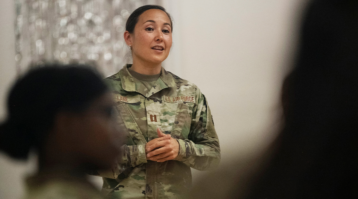 clinical psychologist talking to a group of airmen