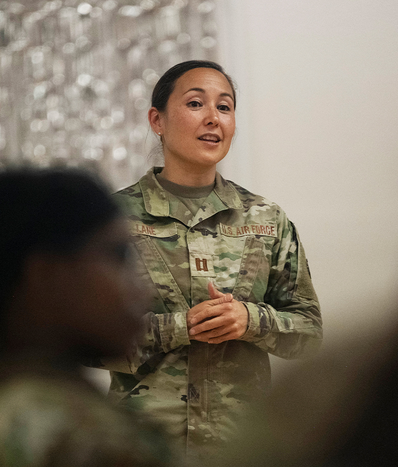 clinical psychologist talking to a group of airmen