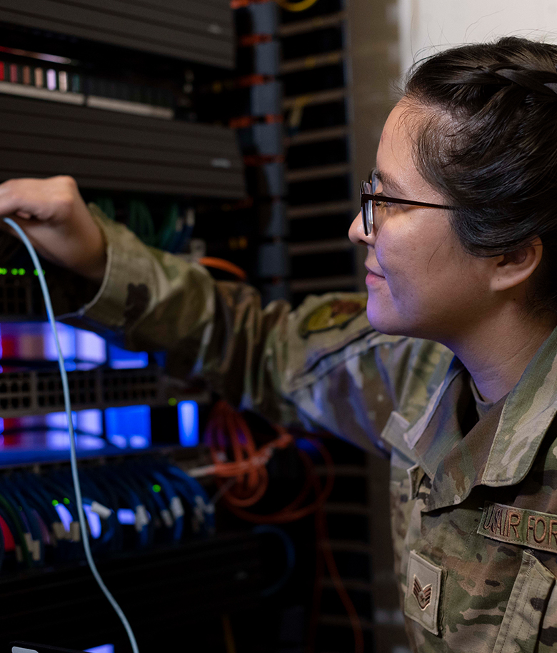 Cyber Transport Systems specialist working on a server