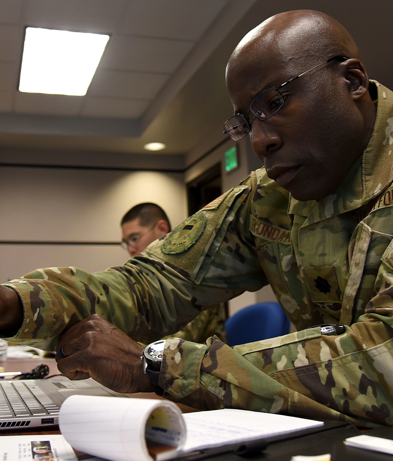 Airman looking at notepad