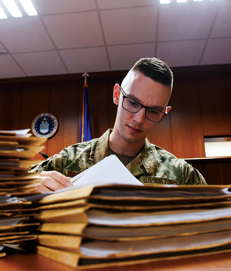 airman reviewing documents