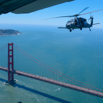 Air National Guard helicopter flying over the Golden Gate Bridge